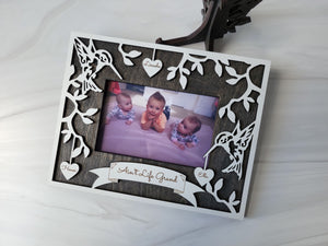Hummingbird wood photo frame adorned with engraved hearts of your loved ones. Matching hummingbird stand included. Custom colors available to match any decor.